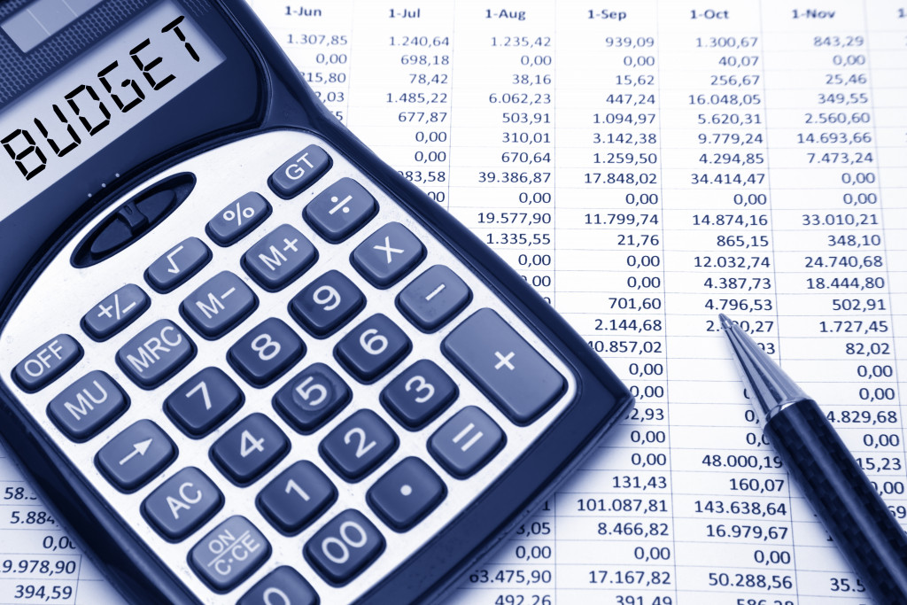budget concept text on calculator on top of financial data