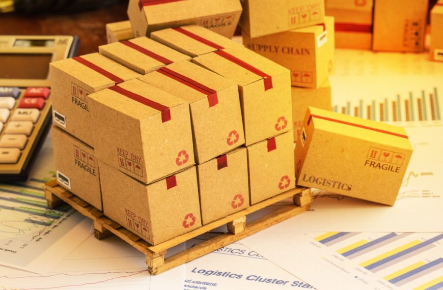 boxes labeled for logistics and supply chain management on top of documents