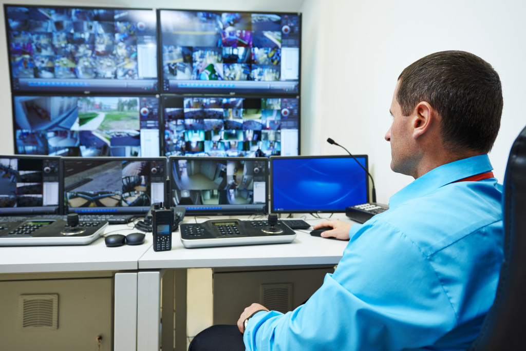 a man watching a surveillance system