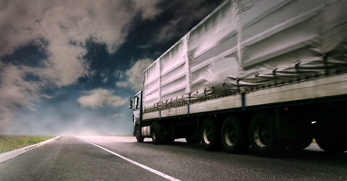 A cargo truck running on a highway